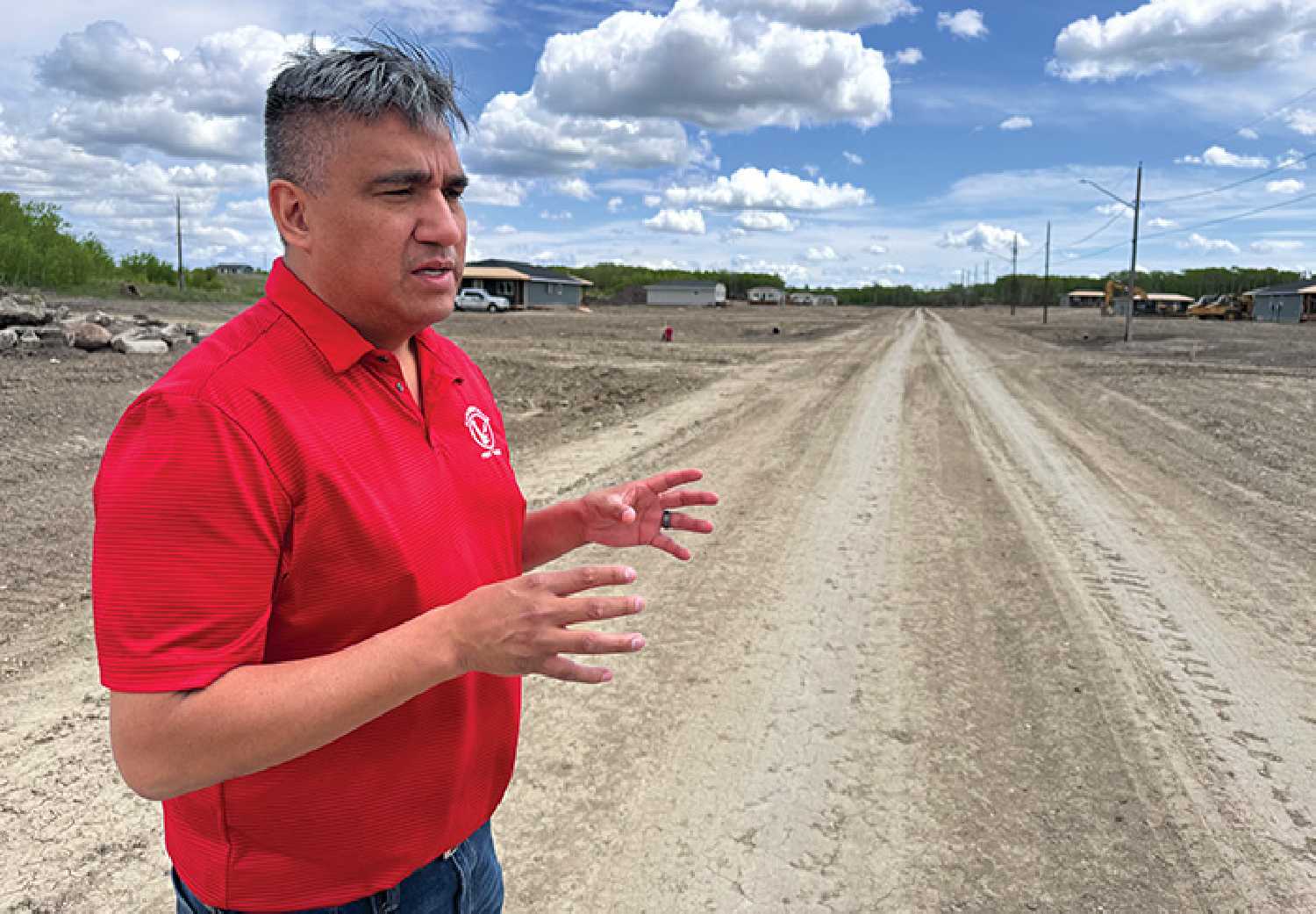 Chief Evan Taypotat looks over a new housing development under construction on Kahkewistahaw First Nation.